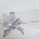 Invitation with opening on top & Silver colored applique